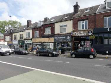 Shops on Chesterfield Road showing (l. to r.) No. 105 The Log Shop; Nos. 107 - 109 Spinning Discs, vinyl record shop; No. 111 Cheeba Chuba, cafe and No. 113 Master Barber 