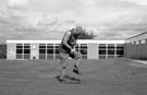 Caretaker Bob Higgins re-turfing the school playing at Southey Green Junior School, Crowder Avenue