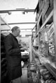 Grocery delivery man working on Mansel Road from his old Fletcher's bakery van