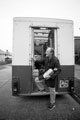 Grocery delivery man working on Mansel Road from his old Fletchers bakery van