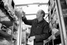 Grocer delivery man working on Mansel Road from his old Fletcher's bakery van