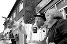 Police Community Support Officer talking to resident Sharon Wrigglesworth by Margetson Crescent shops