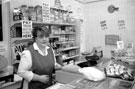 Assistant Caroline in Erich Suck's butcher/grocery shop, Margetson Crescent