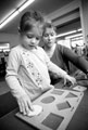 Shape sorting with nursery nurse Jenny Amos, Denby Street Nursery, Highfield