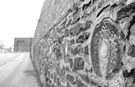 Grinding wheels in the wall on the site of the former Attercliffe Steel Works, Stevenson Road, Attercliffe