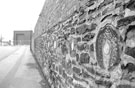 Grinding wheels in the wall on the site of the former Attercliffe Steel Works, Stevenson Road, Attercliffe