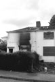 Demolition and rebuilding work showing a burned out house, Travey Road, Manor Estate