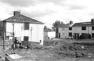 Demolition and rebuilding work, Queen Mary Road between Travey Road and Fairleigh, from waste ground along Travey Road, Manor Estate