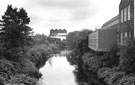 River Don looking north from Newhall Bridge  with the Gun Shop, River Don Works in the background