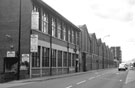 S and M Furnishings (foreground) and Dynamic Die and Steel Ltd., Savile Street East (signs are for Allen Upholstery)