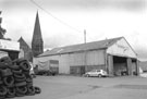 R.H. Hartley, haulage and plant hire, Holywell Road and the former St. Thomas Church in the background