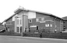 No. 1, Black Horse, personal finance (left) and No. 2  L.W.B. Refactories (right), Hayland Street from Meadow Hall Road