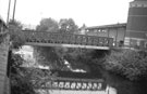 Hadfields Bridge (once an entrance to Hadfields Hecla Works) over the River Don linking Meadowhall Shopping Centre and Five Weirs Walk with Meadowhall Road