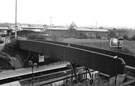 Footbridge over platform No. 3 (left) and No.4 (right), Meadowhall railway station, Meadowhall Interchange with Meadowhall shopping centre in the background