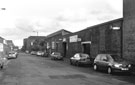 Former Wardlows Ltd.,Congress Works steel manufacturers occupied by Vaux Tyres (right) and Hills Office Supplies (centre), No. 30 Carlisle Street looking towards Cyclops Works