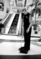 Cleaning Staff with the Escalators leading to the upper level of the Arcade in the background, Meadowhall Shopping Centre, Meadowhall