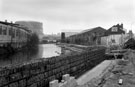 View: c02096 Construction entrance/exit leading to the Bailey Bridge, Five Weirs Walk, Attercliffe Road with The Tempered Spring Co. Ltd. Spring Works (left)