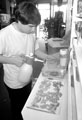 Shop Assistant, Dominic Podmore feeding a corn snake, The Snake Shop, No. 678, Attercliffe Road