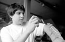 Shop Assistant, Dominic Podmore feeding a panther chameleon, The Snake Shop, No. 678, Attercliffe Road