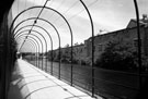 Pergola walkway linking the Bailey Bridge from Effingham Street and Savile Street, Five Weirs Walk/Transpennine Trail with Tempered Spring and Co. Ltd., Spring Works (right)