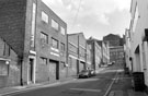 Nos. 28-42, Paramo Tool Group, hand tool manufacturers; No. 26, Aizelwood and Casson Flooring Ltd. Bailey Street looking towards Trippet Lane