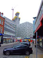 Looking down Charles Street towards the Q Park multistory car park with City Lofts apartment building under construction in the background