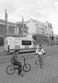 View: c03325 Youths and their bikes as a police van passes on Arundel Gate with the Central Library in the background