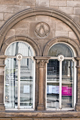 Carving above windows of The Graduate public house, No. 94 Surrey Street