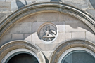 Carving above windows of The Graduate public house, No. 94 Surrey Street