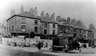 View: s00374 Shops on Barkers Pool known as Pool Place, prior to demolition in preparation for the War Memorial, note the 'Iron Man' Public lavatory. Holly Street, left