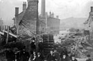 View: s00572 Sheffield Flood, damage at Wm. Makin and Sons, steel converters, refiners and rollers, Clifton Steel Works, Sandbed Wheel (in background), from the Goit fed by River Don