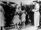 View: s03458 Royal visit of the Duchess of York. Receiving bouquets at Painted Fabrics Ltd., Meadowhead. Captain Lionel Scott of Painted Fabrics is standing immediately behind the Duchess.