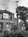 Woodhouse Market Cross and stocks, Market Square/Market Place. The cross was erected in 1775 by Joshua Littlewood. A sun dial and weather vane were added in 1826