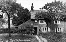 Mr. Ibbotson, at the door of Cherry Tree Farm, Cherry Tree Lane, built 1673 by Robert Savage