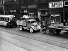 View: s13156 Traffic on Attercliffe Road with shops: Watts and Co., A. Jennings and Sons Ltd., Kays and Timpsons visible