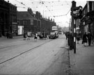Streetscene on Attercliffe Road with properties including No. 570 Sheffield Savings Bank, Nos. 566 - 568 Hartley and Son Ltd. and No. 548 Robin Hood public house