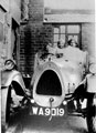 Mrs Holmes and family in Bean car No. WA 9019 in Chapel Street, Woodhouse