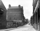 View: s15501 Looking towards Howard Street and Eyre Lane from Howard Street (Dinner Hour) Club for Working Women and Girls (left), former premises of Thomas Otley and Sons, Britannia metal manufacturers, left