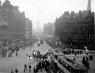 Elevated view of Fargate and Town Hall Square, 1925-1935, showing unidentified parade, Albany Hotel and Yorkshire Penny Bank, right, Bank Chambers, left