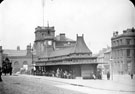 View: s16036 Omnibus Waiting Rooms, Fitzalan Square, before trams, Market Street, left (later became part of Fitzalan Square), Fitzalan Market Hall and General Post Office (Haymarket) in background