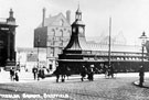 View: s16039 Fitzalan Square, 1890-1915. Omnibus Waiting Room, foreground, Bell Hotel and Wonderland entertainment booth in background