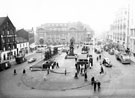 View: s16069 Fitzalan Square from High Street, Bell Hotel, No. 9 The Sleep Shop, bedding retailers, left, General Post Office, Baker's Hill and King Edward VII Memorial, centre, The White Building, right