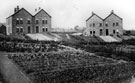 Nos 19 and 21, left, Nos 15 and 17, right, Broomfield  Road, Stocksbridge. Houses for Samuel Fox staff. Sportsground in background