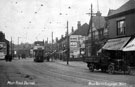 Main Road, Darnall showing No. 265 Cyril Boynton's watchmaker and jeweller next to No. 245 The Rose and Crown public house with W.W. Fawcett's roofing contractors van outside