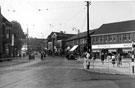 Streetscene on Main Road, Darnall at the junction with Greenland Road showing Nos 215/221, Henry Wigall and Son Ltd., Darnall Wesleyan Church (centre) and No. 222 Wellington Inn (left)