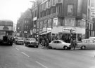 View: s18061 Pinstone Street at junction with Cross Burgess Street, premises include No. 68 Helene (Sheffield) Ltd., ladies outfitters, No 70, J.W. Thornton Ltd., confectioners, No. 88 Midland Bank Ltd.