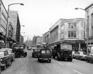 View: s18084 The Moor, including Pauldens Ltd., department store, left, Nos. 15 - 19 F.W. Woolworth and Co. Ltd., Bazaar