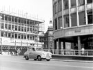 View: s18132 Moorhead looking towards Furnival Gate, construction of offices and shop units and former Newton Chambers, then owned by P.W. Lacey Ltd., footwear and outfitters