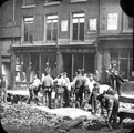 View: s18330 Norfolk Street from Norfolk Row, laying telephone cables, No. 89 George C. Boyd, tailor, No. 89A Joseph Thompson Tailor, plumber, Nos. 91 - 93 Sarah Shaw, confectioner