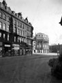 Pinstone Street, 1910-1930, premises include No. 6 William Timpson Ltd., shoe shop, No. 8 Fleming, Reid and Co. Ltd., hosiery store, No. 10 Haycock and Jarman Ltd., tailors, No. 12 Constance Favell, outfitters, Wilson Peck Ltd., in background